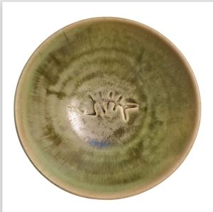 Hand tossed stoneware bowl. Green. Signed on bottom